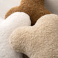 Close-up of bouclé texture on bone pillows