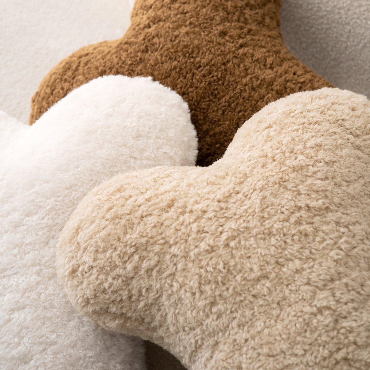 Close-up of bouclé texture on bone pillows