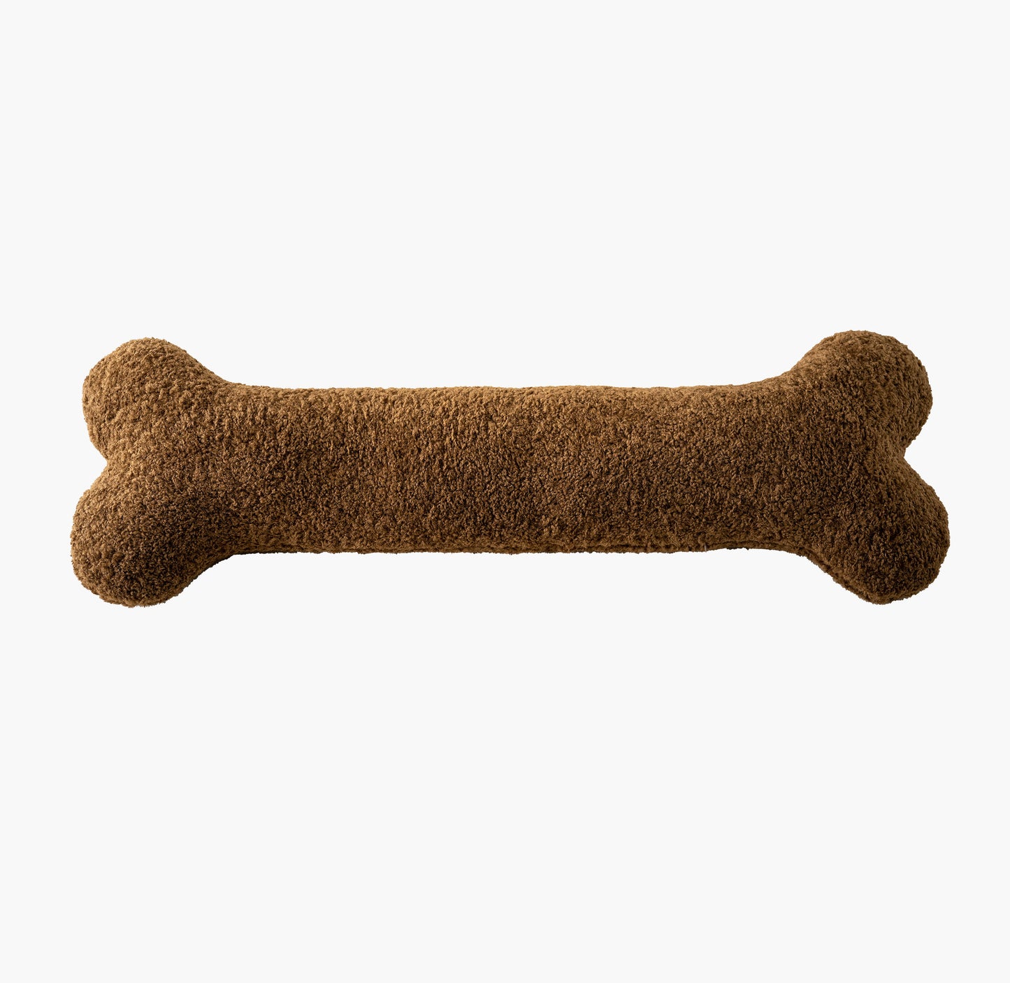 Caramel brown bone pillow flat lay