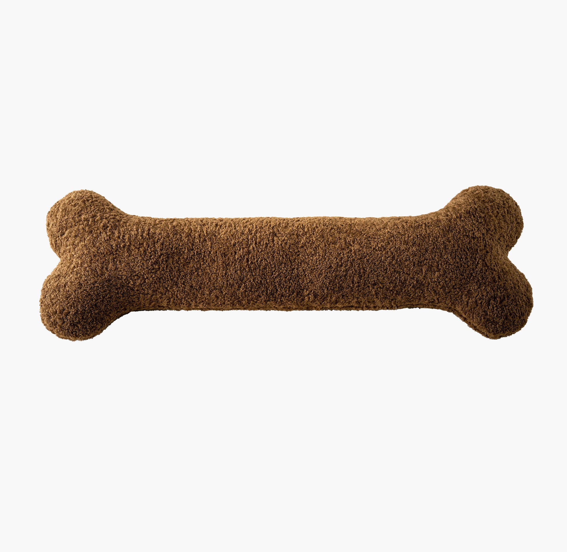Caramel brown bone pillow flat lay