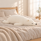 White Sleepy Polar Bear Plush Body Pillow on a bed